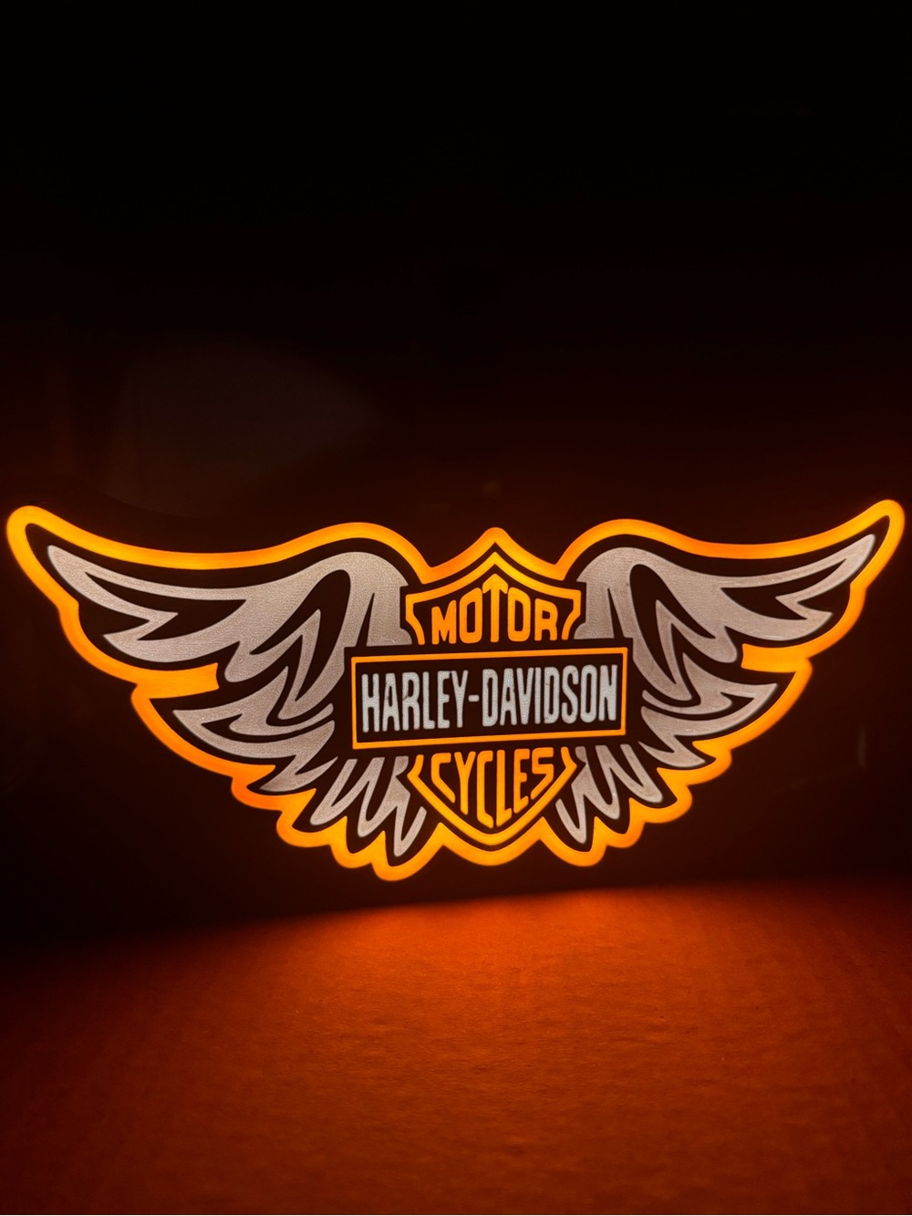 Illuminated Wing‎ Logo Sign in Orange and White